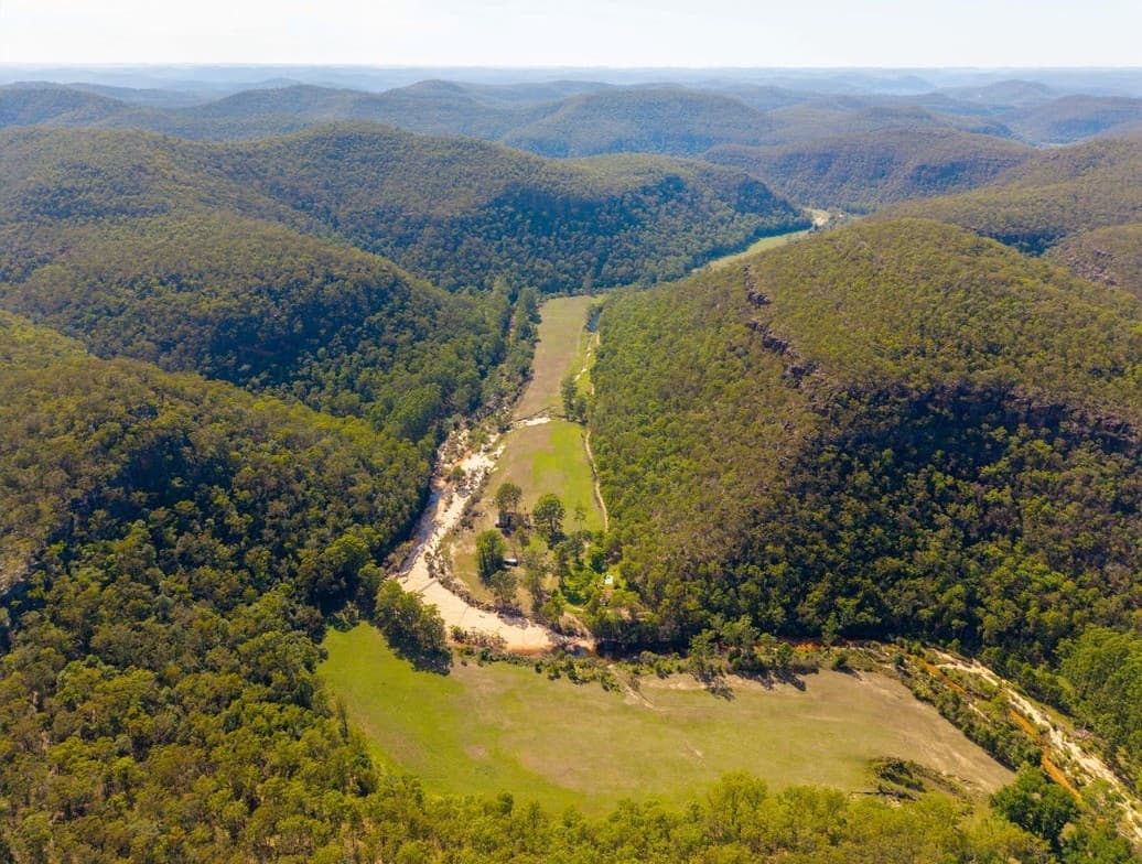 Valley, creek and ranges toward the horizon