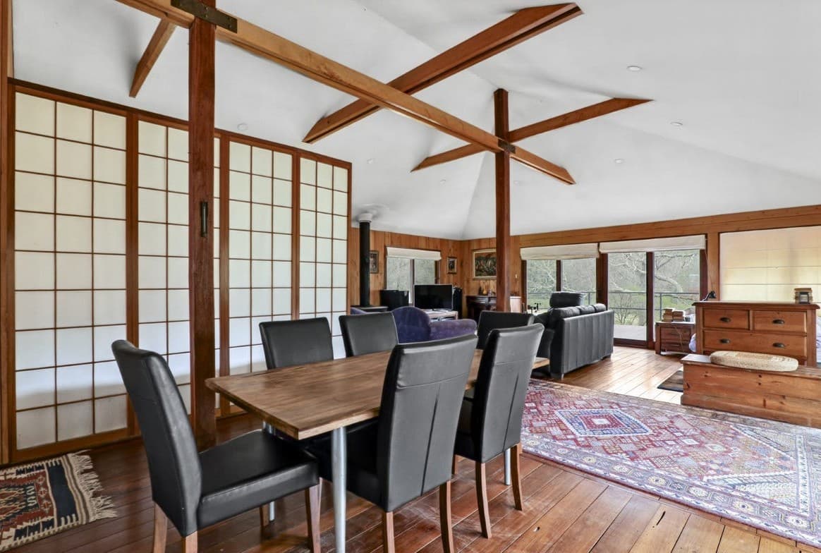 Cottage dining room with timber ceiling